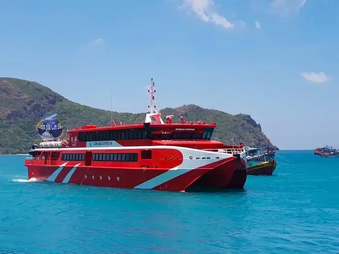 Passengers boarding the ferry to Phu Quoc under clear blue skies.