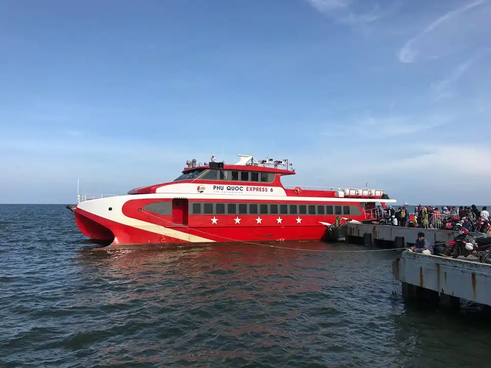 Ferry to Phu Quoc crossing calm sea waters with island views in the distance.