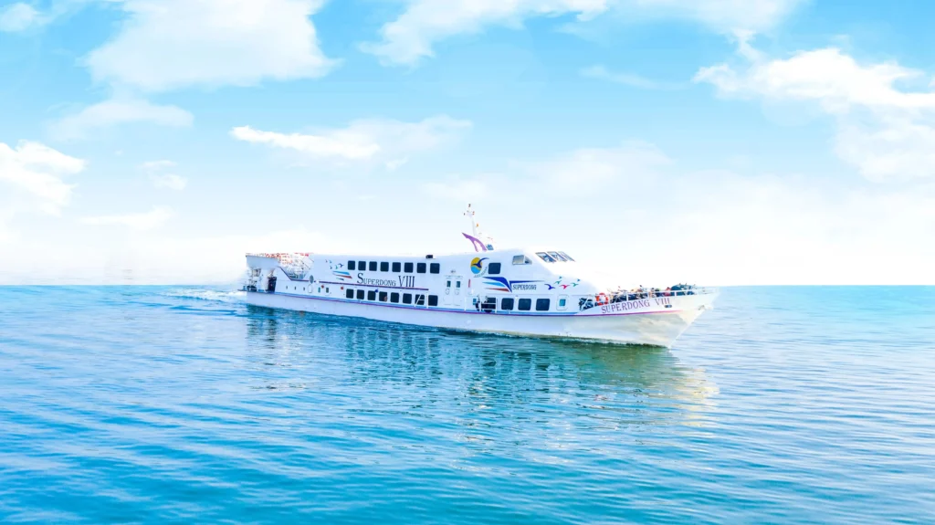 Ferry to Phu Quoc crossing calm sea waters with island views in the distance.